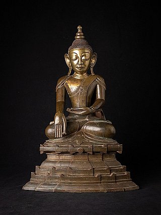 Antique bronze Ava Buddha from Burma in the earth-touching gesture, on a stepped base