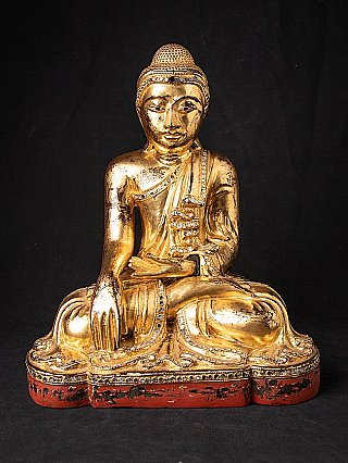 Antique gilded wooden Mandalay Buddha from Burma with the typical band across the forehead