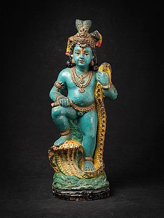 Antique Indian painted terracotta Krishna standing on the five hoods of the serpent Kaliya