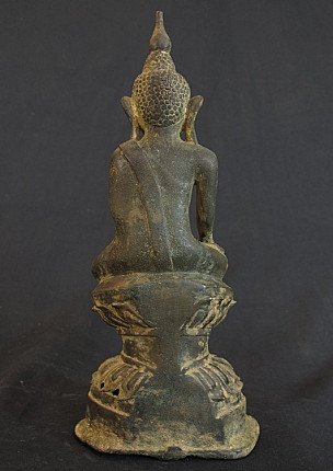 Seated Ava Buddha statue in bronze, rear view with robe over shoulder