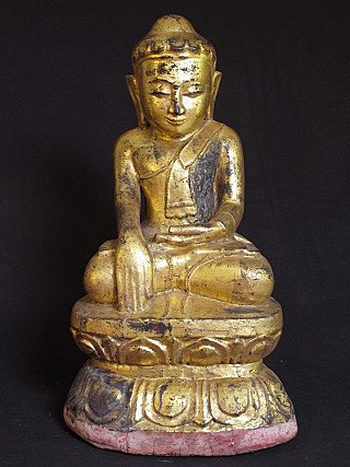 Wooden Buddha statue from Burma (Myanmar), 19th century, seated on lotus base, front view