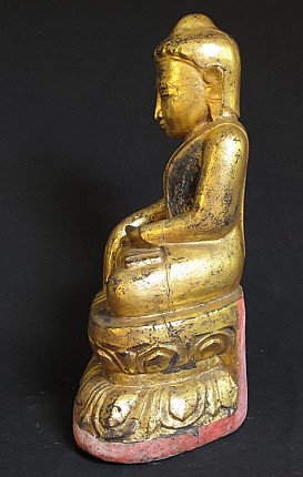 Seated wooden Buddha statue from Burma (Myanmar), left side profile on lotus base