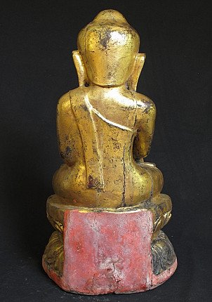 Wooden Buddha statue from Burma (Myanmar), rear view showing worn gilding and red base panel