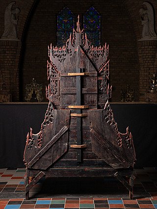 Rear view of the antique Burmese wooden throne showing the wooden braces and frame