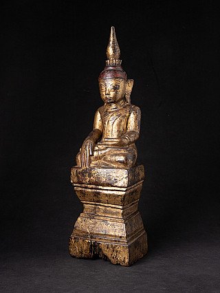 Shan Buddha statue from Burma (Myanmar) in wood, three-quarter view showing the stepped base