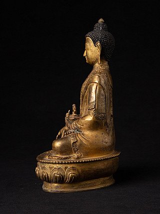 Nepalesische Medizin-Buddha-Statue aus Bronze, sitzend, linke Seitenansicht