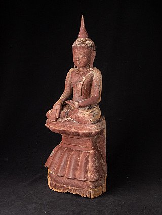 Burmese wooden Buddha statue in bhumisparsha mudra, three-quarter left view