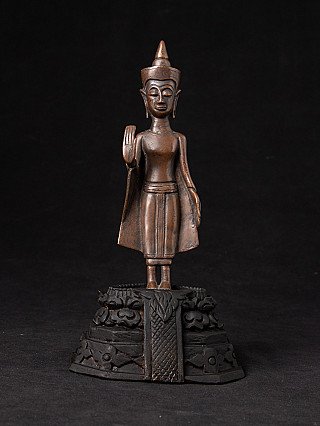 Thai bronze Buddha statue on ornate base, full-front view with abhaya mudra