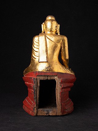 Antike hölzerne Buddha-Statue aus Myanmar, Rückansicht mit offener Höhlung im roten Sockel