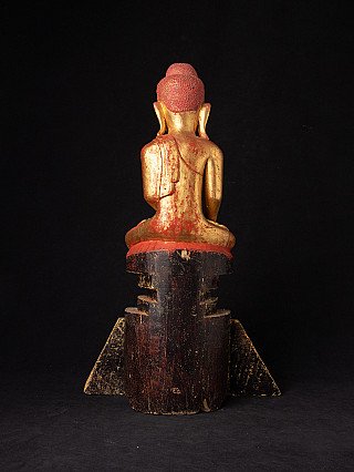 Antike Holz-Buddha-Statue, Rückansicht mit roter und goldener Fassung am Rücken und Haar