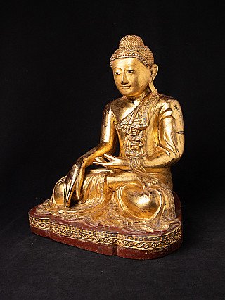 Mandalay Buddha statue from Burma (Myanmar) in wood, three-quarter view showing the gilded surface