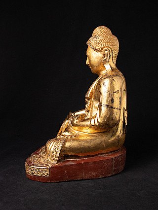Antique wooden Mandalay Buddha statue from Burma (Myanmar), left side profile view