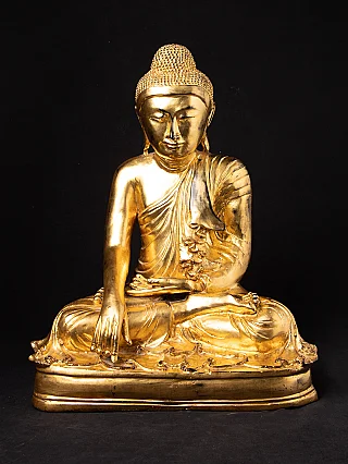 Old bronze Mandalay Buddha statue