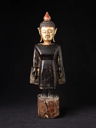 Antique wooden Tai Lue Buddha statue