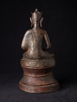 Bronze Buddha statue from Burma (Myanmar), seated on tall base, rear view