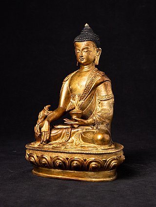 Bronze-Medizin-Buddha-Statue aus Nepal in Dreiviertelansicht, mit Lotossockel und Handattribut