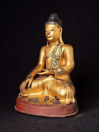 Bronze Buddha statue from Myanmar, three-quarter view with inlaid robe border