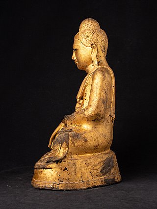 Bronze Buddha statue from Burma, left side profile showing the seated posture
