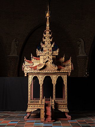 Wooden temple shrine from Burma (Myanmar), full-front view with tall spire and arches