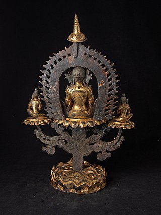 Antike Buddha-Statue aus Nepal in Bronze, Rückansicht mit durchbrochener Aureole und zwei Begleitfiguren