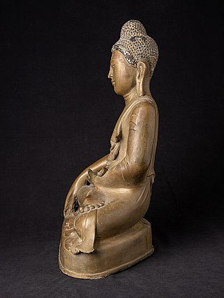 Mandalay bronze Buddha statue, left side profile of the seated figure