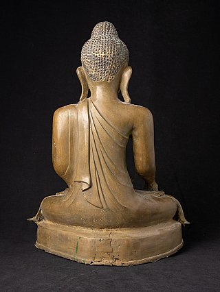Burmese bronze Buddha statue, rear view showing robe folds and damage on the base