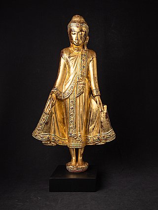 Burmese wooden Buddha statue in Mandalay style, full front view with gilded robe
