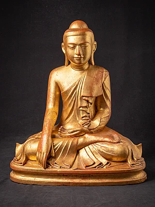 Antique wooden Mandalay Buddha statue