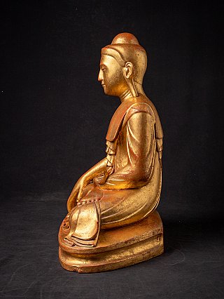 Wooden Buddha statue from Burma (Myanmar), seated, left side profile