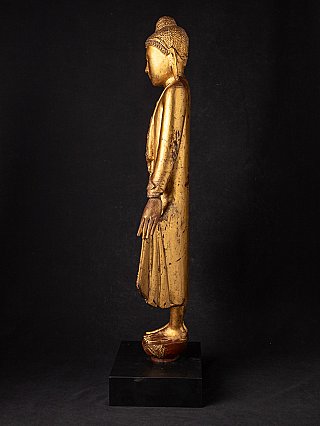 Burmese Buddha statue in Mandalay style, left side profile view