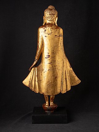 Wooden Burmese Mandalay Buddha statue, rear view with surface wear