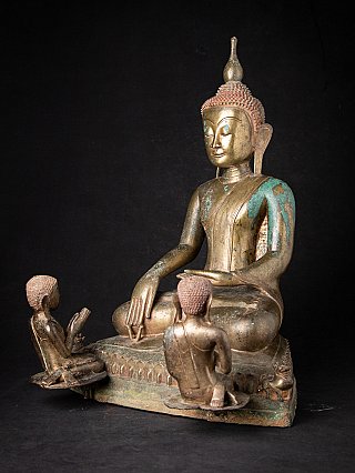 Burmese bronze Buddha statue with two monks at the base, three-quarter right view
