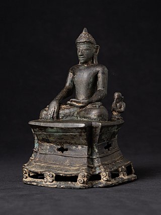 Bronze Buddha statue from Arakan, three-quarter view from the left on tall base