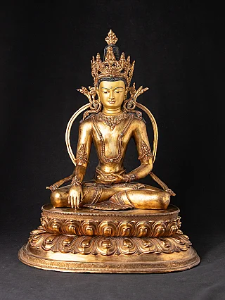 Old Nepali bronze crowned Buddha statue