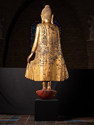 Burmese Shan Buddha statue in wood, rear view with worn gilded surface