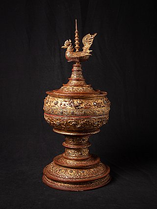 Gilded Burmese lacquerware offering vessel with bird finial on lid, three-quarter view