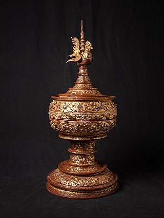 Burmese lacquerware offering vessel with gilded relief decoration, angled view with bird finial