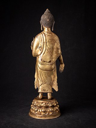 Nepalische Buddha-Statue aus Bronze, Rückansicht mit Gewand und Lotossockel