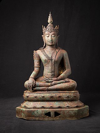 Thai Lanna Buddha statue in bronze, crowned and seated in bhumisparsha mudra, front view
