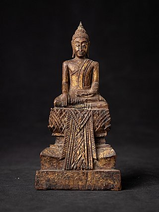 Thai wooden Buddha statue seated in bhumisparsha mudra, full front view on carved base