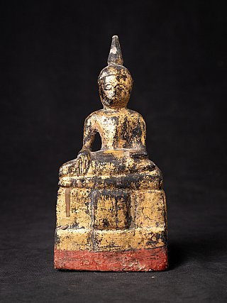 Thai wooden Buddha statue, seated, front view with right hand lowered