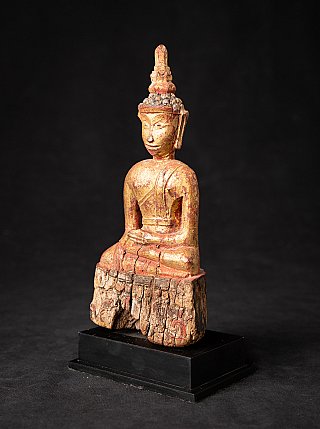 Thai wooden Buddha statue seated in bhumisparsha mudra, three-quarter right view