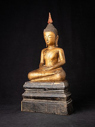 Antique wooden Thai Buddha statue