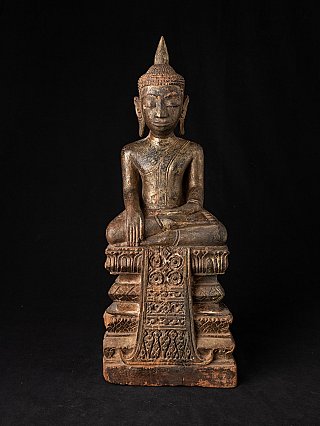 Thai wooden Buddha statue seated in bhumisparsha mudra, full-front on carved base