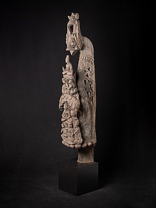 Antique Burmese wooden panel, three-quarter view showing pierced foliage carving on the side
