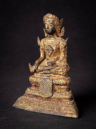 Buddha statue from Thailand in bronze, three-quarter left view with ornate base