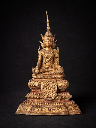 Thai bronze Buddha statue seated in bhumisparsha mudra on ornate tiered base, full front