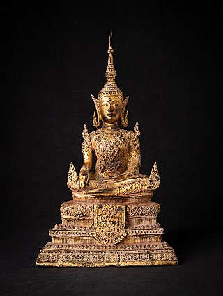 Thai bronze Buddha statue with crown in Bhumisparsha mudra, seated on ornate tiered base