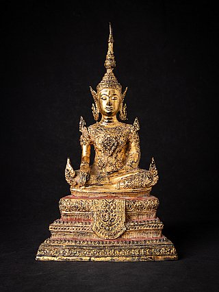Thai bronze crowned Buddha statue in bhumisparsha mudra, full front view on ornate base