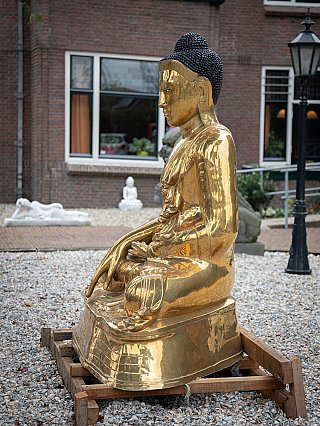 Burmese bronze Buddha statue, seated, left side profile view